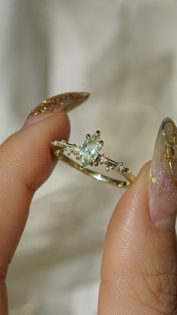 Laurie Fleming on Instagram: "Imbued with otherworldly magic🧚 An elven marquise diamond with the spirit of the forest at the centre of this One of a Kind green gold White Wisp." Fairy Rings Jewelry, Forest Engagement Ring, Fairy Wedding Rings, Engagement Rings Fairy, Fairy Wedding Ring, Wed Rings, Fairy Engagement Ring, Laurie Fleming, Fairy Rings