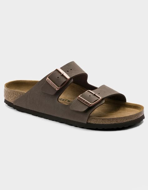 Birkenstock Arizona Sandals. The Often Imitated, Never Duplicated, Category-Defining, Two-Strap Wonder From Birkenstock. A Comfort Legend And A Fashion Staple. With Adjustable Straps And A Magical Cork Footbed That Conforms To The Shape Of Your Foot, A Truly Custom Fit Is As Effortless As The Classic Design. -narrow Width (fits Like A Us Medium Width) -birkibuc – A Durable, Synthetic Upper Material With A Nubuck Leather-Like Texture And A Soft Backing -contoured Cork Footbed Conforms To The Shape Of Your Foot And Features Pronounced Arch Support, A Deep Heel Cup, And Roomy Toe Box; Lined With Suede -lightweight Eva Sole For Cushioning And Shock Absorption -avoid Extreme Heat -imported | Birkenstock Arizona Mocha Sandals Burken Stocks Shoes, Birkenstock Mocha, Birkenstock Arizona Mocha, Shearling Sandals, Clear Backpacks, Unisex Sandals, Sandals Birkenstock, Birkenstock Sandals Arizona, Cork Material