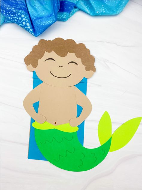 This boy mermaid puppet is a fun ocean themed craft for boys to make! Download the free printable template and create it this summer. Mermaid Puppet, Mermaid Boy, Ocean Theme Crafts, Snail And The Whale, Male Mermaid, Paper Bag Crafts, Headband Crafts, Mermaid Crafts, Ocean Backgrounds