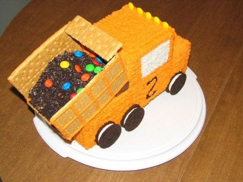 All buttercream.  I used a bread pan for the truck body, and cab.  Graham crackers for the bed, along with crushed Oreos for dirt, and M's.  A Snickers bar is underneath the bed to tilt it up. Truck Cake Design, Dump Truck Birthday Cake, Dump Truck Cake, Dump Truck Cakes, Truck Birthday Cakes, Construction Cake, Truck Cake, Truck Cakes, Train Cake