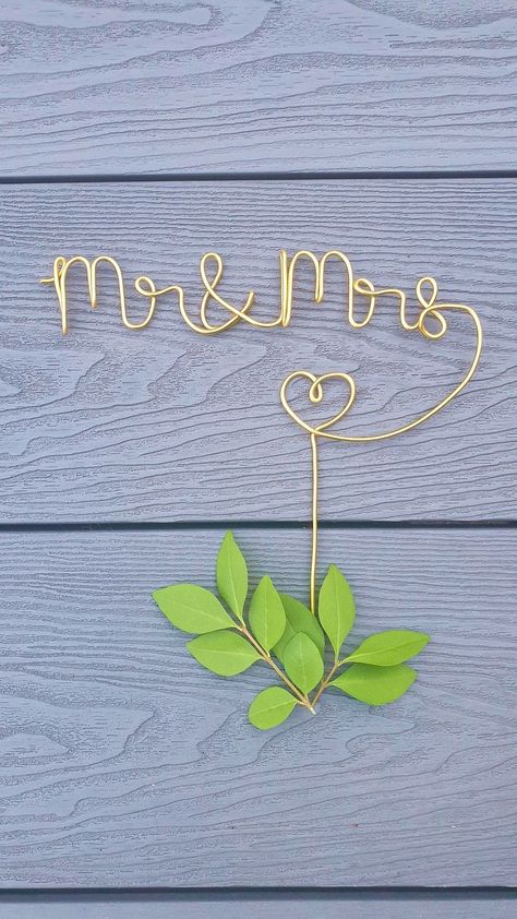 https://www.etsy.com/uk/listing/1304803827/mr-mrs-wire-cake-topper-for-wedding-cake?click_key=bfcd22e2f7767bacdb64e5fa091dd9818a29d9f1%3A1304803827&click_sum=8540345a&ref=shop_home_active_1 Diy Cake Toppers, Wire Figures, Wire Cake Topper, Copper Wire Crafts, Cake Topper For Wedding, Wire Words, Crafting Wire, Wire Knitting, Wire Wrapped Stone Jewelry