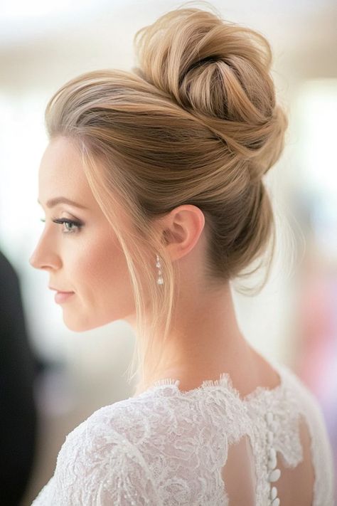 Make your big day magical with these 35+ gorgeous high bun hairstyles! These styles are perfect for updos that stay flawless from the aisle to the dance floor. Don’t miss your chance to explore the most stunning wedding hair ideas. Click to view now! #bridalbeauty #weddingupdos #highbunhairstyles Mid High Bun Wedding Hair, High Chignon Updo, High Bridal Bun, High Wedding Updo, Bridal High Updo, High Bun Bridal Hair, High Bun Bridal, Bridal High Bun, Bun Bridal Hairstyles