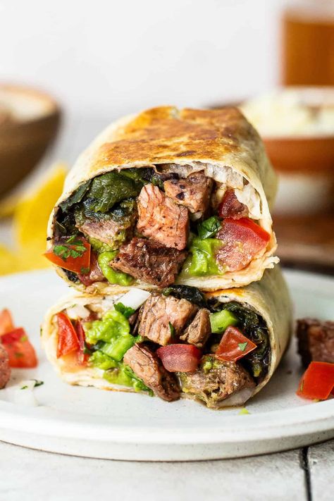 How to make an authentic carne asada burrito with marinated skirt steak, amazing toppings, and fresh salsa. A flavorful classic you'll love! Steak Burrito Recipe, Authentic Carne Asada, Mexican Burritos, Carne Asada Burrito, Marinated Skirt Steak, Avocado Tuna Salad, Roasted Poblano Peppers, Chicken Tacos Easy, Roasted Poblano