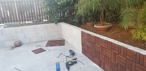 Cinderblock Wall Makeover Backyard, Covering Cinder Block Walls Outdoor, Ikea Tiles, Wood Pallet Planters, Cinder Block Walls, Pallet Planter, Outdoor Accents, Backyard Diy Projects, Block Wall