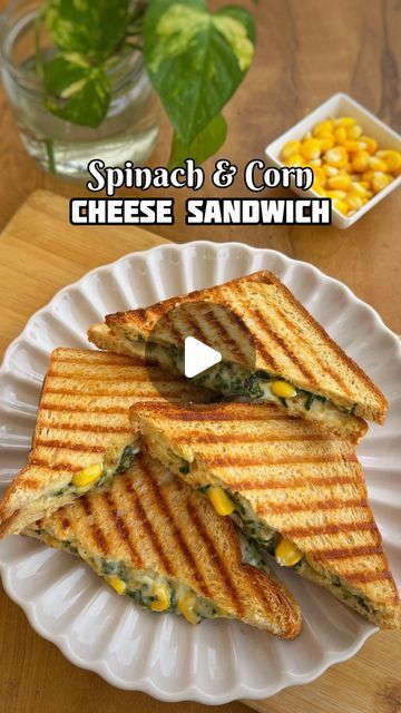 Mad Over Food on Instagram: "Cafe Style Spinach & Corn Cheese Sandwich at home 😃❤️. 
1. Heat oil and sauté 1 tbsp garlic and half onion. Add 1/2 cup boiled corn and cook for 2 mins. Add 100g chopped spinach and cook until water evaporates. 
2. Now heat 1 tbsp butter and add 1 tbsp maida and cook for 30 seconds. Mix everything and pour in 1 cup milk. Add salt, pepper, oregano and chilli flakes. Cook until it thickens and add cheese. 
3. Sandwich the filling between two bread slices with a cheese slice. Grill or toast it with butter and serve immediately 🫶. 

Do try it out and send me your feedback pictures. 

#sandwich #corncheese #toast #yummy #goodfood #foodporn #foodphotography #recipereels #reelitfeelit #reelkarofeelkaro #sandwiches #spinachcornsandwich #cheese #cheesyrecipes" Cheese Corn Sandwich, Instagram Cafe, Cheese Slice, Corn Cheese, Boiled Corn, Garlic Cheese, Cheesy Recipes, Chopped Spinach, Cafe Style