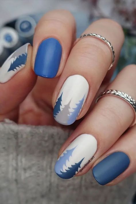 Here are 15 winter nail art ideas and designs you’ll definitely want to try out this year. Credit: evelinail_art Nails For Switzerland, Nails With Tree Design, New Gel Nail Designs 2023, Nails Tree Design, Trendy Winter Nail Designs, Beach Winter Nails, Alaska Vacation Nails, Earth Nail Art, Mountain Nail Ideas