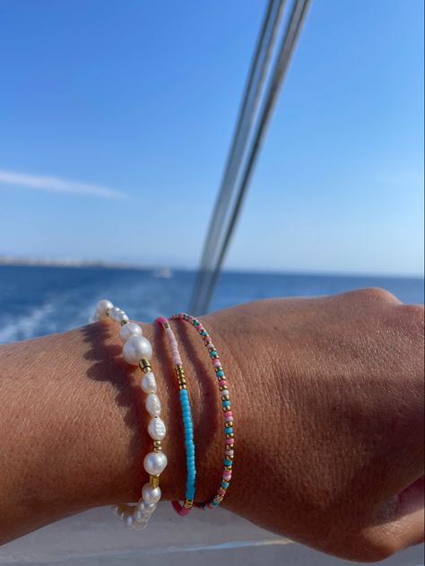 Summer bracelets worn on a sunny day at the sea Greece Bracelet Handmade, Greece Inspired Jewelry, Greece Bracelet, Vacation Bracelets, Greece Jewelry, Mediterranean Summer, Holiday Bracelets, Turquoise And Pink, White Bracelets