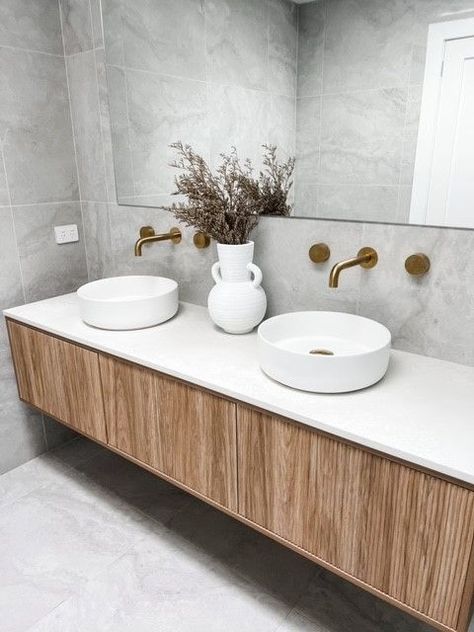 The benefits of using one tile choice and a fully tiled bathroomHere’s how this bathroom design has been elevated by using one single tile selectionThe room looks more spacious as the tiles bounce light around the roomfrom the walls to the floorThey have created a neutral base for the bold brushed brass fittings to shineIt has created a cohesive and seamless design that can be used across their entire your homeSets the moodthis bathroom has a cool and tranquil feeldue to Grey Travertine Bathroom, Medium Bathroom, Tile Choice, Light Grey Bathrooms, Fully Tiled Bathroom, Travertine Bathroom, Tile Selection, Tiled Bathroom, Grey Bathroom Tiles