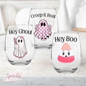 Sip in Style, Anytime, Anywhere! This adorable and trendy glass is perfect for anyone! Funny and functional, these custom girly Halloween stemless wine glasses hold 20.5 oz of pure bliss! Permanently UV printed with these adorable Pink-o-Ween graphics!

#halloween2024 #pinkoween #girlyhalloween #creepitreal #heyghoul #heyboo #spookyseason #pinkhalloween #retrohalloween #girlyhalloween #cuteghost #halloweenhaul Halloween Glasses, Creep It Real, Halloween Wine, Hey Boo, Pink Halloween, Stemless Wine Glasses, Retro Halloween, Cute Ghost, Ink Color