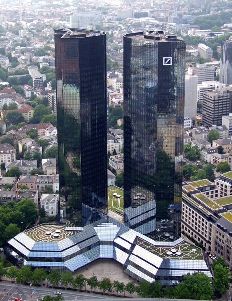 While Deutsche Bank has faced some financial challenges in recent years, it has not collapsed, and it is not currently having a significant impact Europa Park, Skyscraper Architecture, Frankfurt Germany, Architecture Building Design, Urban Architecture, Futuristic Architecture, Germany Travel, Lonely Planet, Places Around The World