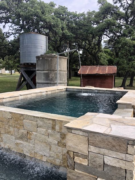 This pool used to be a 300 year old cistern and water tank. Plus, it's an infinity pool! The catch basin is a spa. Water Cistern Ideas, Old Cistern Ideas, Stock Tank Water Feature, Water Tank Pool, Water Trough Pool, Ranch Vibes, Rustic Hot Tubs, Pool Landscapes, Raised Pools