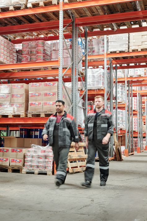 Two young intercultural male workers in uniform moving along large factory by Pressmaster. Two young intercultural male workers in uniform moving along large factory or warehouse with huge shelves with packed... #Sponsored #workers, #uniform, #moving, #young Work From Home Canada, 2000s Fashion Men, Factory Photography, Apply Job, Teamwork Skills, Working Men, Modern Factory, Factory Worker, Men's Uniforms