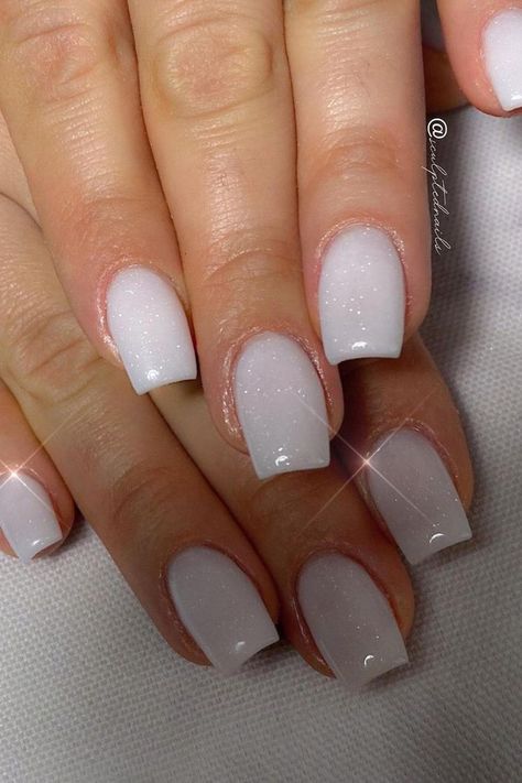 Elegant and understated, these white glitter nails are a vision of subtle sparkle. The almond shape offers sophistication, while the white base is elevated with a dusting of fine glitter that catches the light, reminiscent of a gentle snowfall. Perfect for any occasion that calls for a touch of refined glamor. ✨  // Photo Credit: Instagram @sculptednails Shimmering White Nails, White Sparkle Nails Square, Irredecent Nails White, Sparkling White Nails, White Shine Nails, Milky Sparkle Nails, Milky Winter Nails, White Frosted Nails, Short Acrylic Nails Square White