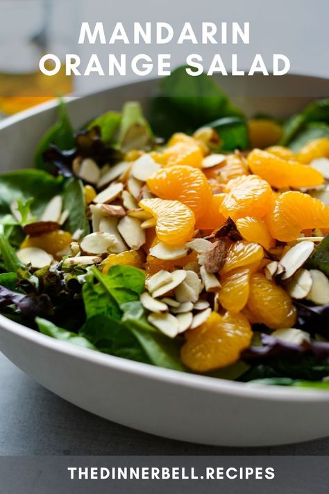 No slicing, dicing or chopping required! This Mandarin Orange Salad is the summer side dish that goes with everything. Sweet oranges, crunchy almonds and a zingy bite from a quick homemade vinaigrette that comes together in minutes. Orange Onion Salad, Asian Salad Mandarin Oranges, Salad With Tangerines, Mandarins Orange Salad, Mandarin Orange Salad Recipes, Salad With Orange Slices, Asian Salad With Mandarin Oranges, Salads With Mandarin Oranges, Manderine Orange Salad