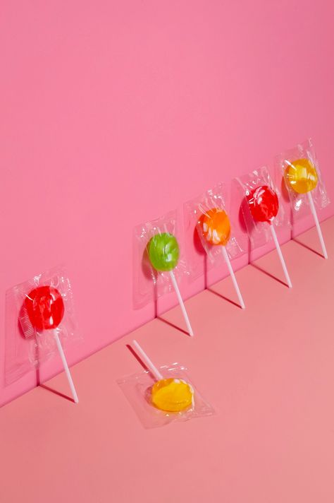 Lollipops Against a Pink Wall and One Lying · Free Stock Photo Candy Product Photography, Colorful Candy Photography, Lollipop Photoshoot, Candy Still Life, Bottle Photoshoot, Lollipop Photography, Lollipop Aesthetic, Candy Aesthetic, Lollipop Display