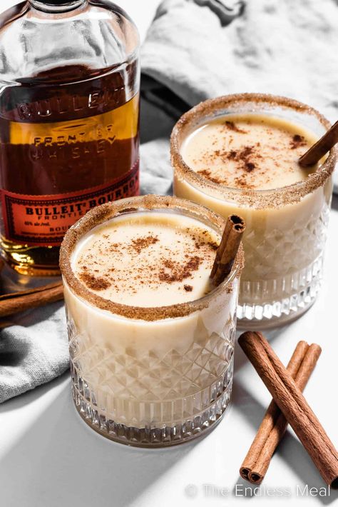 If you longed to dip into the holiday punch bowl that held the spiked eggnog, now's your chance to indulge in this sweet, warm, delicious bourbon eggnog. It's creamy and cozy and perfect for a cold winter's evening. #theendlessmeal #bourboneggnog #boozyeggnog #bourbon #eggnog #christmas #holiday #festive #cocktail #drink Christmas Cocktails Eggnog, Eggnog Bourbon Cocktail, Christmas Eggnog Cocktails, Christmas Cafe Drinks, Holiday Eggnog Cocktails, Christmas Breakfast Cocktails, Yule Cocktails, Egg Nog Cocktail Recipe, Eggnog Drinks Alcohol