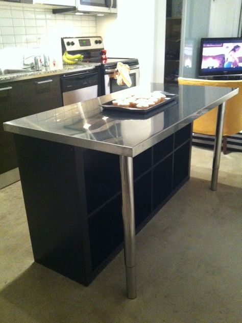 A small, but nice looking center island. Another Ikea hack, all you need is a Expedit Bookcase, Vika Hyttan Stainless Steel countertop, and Vika Byske Legs. Kitchen Island Ikea, Stainless Steel Kitchen Island, Ikea Kallax Shelf, Steel Countertop, Ikea Kitchen Island, Kitchen Island Ikea Hack, Kitchen Island Bar, Ikea Hackers, Kallax Ikea