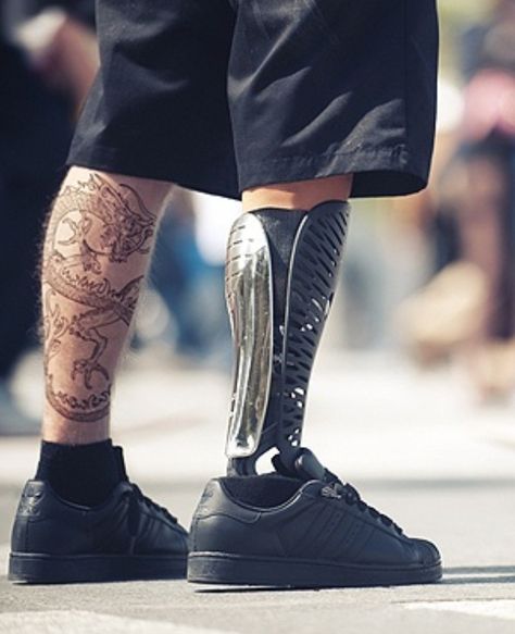 Asian dragon tattoo and cool metallic prosthetic leg. Cp9 One Piece, Asian Dragon Tattoo, Wheelchairs Design, Prosthetic Leg, 3d Printing Service, Medical Design, Tattoo Shop, All Black Sneakers, 3d Printing