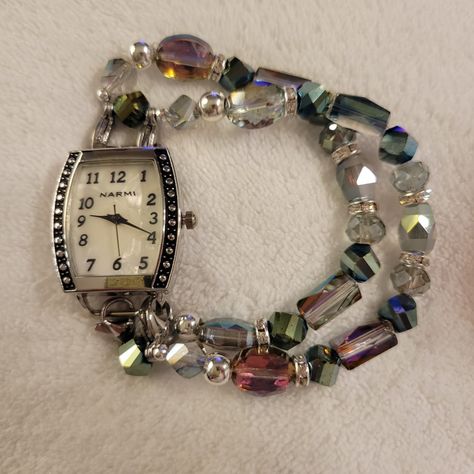 This beautiful woman's stretch interchangeable beaded watch band has green and magenta iridescent beads, silver beads and clear crystal rondelles. Please note, the color of the iridescent beads may vary.  This ladies' watch has a small rectangular pearl face and accents on both sides.   Ladies Watch Band Sizing: simply measure your wrist snuggly with a string or ribbon.  Order your size (sm, med, lg) according to your measurement. Melted Watch, Beaded Watch Bands, Fun Watches, Dope Jewelry Accessories, Beaded Watches, Watches Women, Jewelry Accessories Ideas, Dope Jewelry, Funky Jewelry