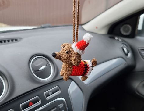 "This miniature dachshund in Santas costume is really cute hanger for your Christmas car decor. ✅MATERIALS: The toy is made of 55% cotton and 45% polyacrylic yarn and stuffed with hypoallergenic fiberfill. ✅ITEM DETAILS: The dachshund approx. 3.9 inches (10 cm) in height with hat. And 3.5 inches (9 cm) in length. ✅Other colors are possible. Just contact me. Find more cute Christmas car accessories for rear view mirror in my shop on section - \"Car accessories\" -  https://www.etsy.com/shop/Happy Crochet Car Accessories Christmas, Christmas Car Accessories, Christmas Car Hanger Crochet, Crochet Christmas Items, Christmas Car Decorations Interior, Christmas Crochet Car Hanger, Crochet Christmas Car Hanger, Crochet Car Ornament, Christmas Car Decor