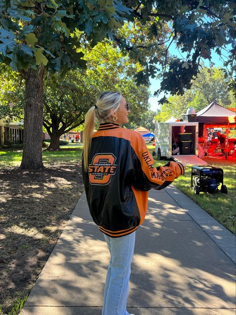 #gameday #outfit #gamedayoutfit #collegefootball #college #collegeoutfit #football #saturday #sportsjacket #bomberjackets #leatherjacket #cuteoutfit #cooloutfit #orangejacket #orangetop #orangeoutfit #footballgame #clothes #oklahomastate #osu #oklahoma #oklahomastateuniversity #outfitideas #sorority #fraternity #vintagecollege #vintagejacket #vintagestyle College Coach Outfit, Okstate Game Day Outfit, University Of Tennessee Outfits, Oklahoma State Outfits, Oklahoma State Gameday Outfits, Fall Gameday Outfit College, College Basketball Game Outfit, Osu Gameday Outfit, Oklahoma State Game Day Outfit