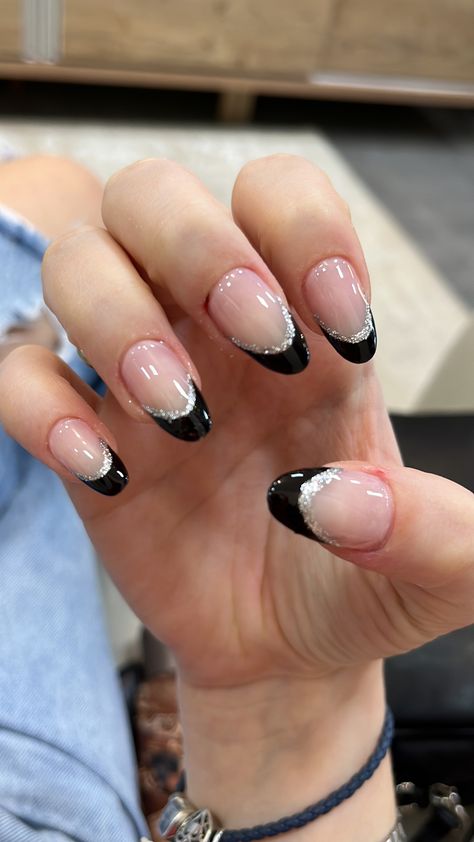 Nails That Go Good With Black Dress, Nails To Get With A Black Dress, Black Glitter Nails Almond Shape, Black French Tips With Silver Line, Black French Tip Nails Sparkle, Nail Ideas Black And Silver, Black French Tip Nails Round, Black And Silver Almond Nails, Black And Silver French Tip