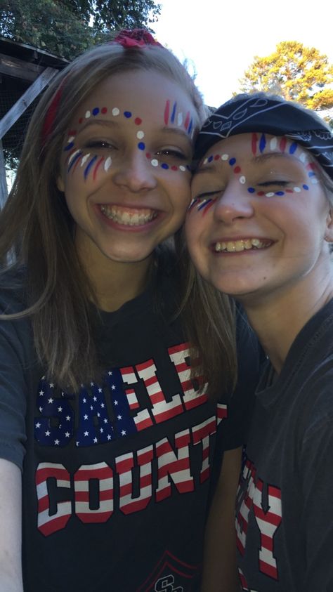 Red White And Blue Face Paint Dots, Sprit Week Face Paint, Red White And Blue Dots On Face, Home Coming Face Paint Ideas, Student Section Face Paint Ideas, Homecoming Paint Face, Easy Fourth Of July Face Paint Ideas, Red White And Blue Face Paint Football, Usa Theme Face Paint