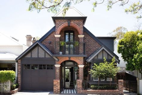 8 Siding Colors That Go Beautifully With Red Brick Exteriors | Hunker Red Brick Black Garage Door, Red Brick With Black Siding, Stucco And Red Brick Exterior, Red Brick And Siding Exterior, Dark Brown Brick House Exterior, Colors That Go With Red Brick, Brick Homes Exterior, Orange Brick House Exterior, Brick Houses Exterior