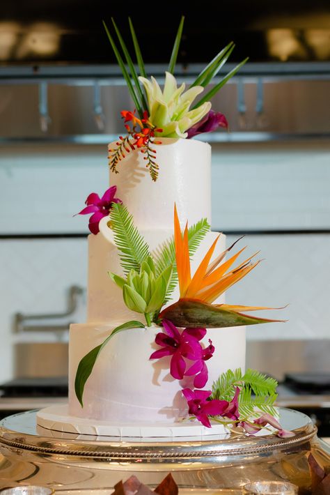 Tropical Cake Flowers at Hotel Emma | Birds of paradise, calla lily purple, lily oriental siberia white, orchids dendrobium purple and white, robellini palm | Photo by: Two Sapphires Photography | Jill McCarty with Couture Concierge Plant Wedding Bouquet, Robellini Palm, Lily Purple, Tropical Cake, Hotel Emma, Flower Cake Decorations, Purple Lily, Birds Of Paradise Flower, Lily Plants