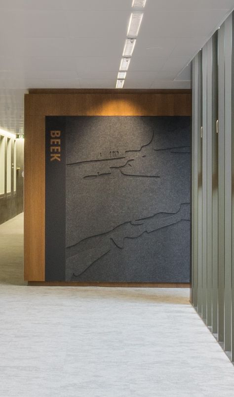 To tackle the acoustic challenges of Rijkskantoor OV Terminal, PET Felt panels were installed on the walls. Creative cut-outs contribute to the interior concept, while the sound-dampening nature of PET Felt minimises the noise in the hallways. #office #interiordesign #officeinterior #creativeinterior #designinspo Felt Panels, Acoustic Wall Design, Felt Wall Panels, Felt Wall, Acoustic Panel Design, Office Acoustics, Acoustic Panel Design Offices, Zintra Acoustic Panels, Acoustic Foam Wall Design