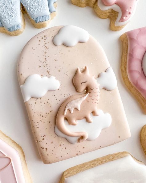 Give me allllll the unique themes! Loved this dragon gender reveal theme so much 🐉 . . . . . . . . . . . #genderrevealparty #genderrevealcookies #babyshowercookies #babyshowertheme #babycookies #dragoncookies Gender Reveal Theme, Fairytale Baby Shower, Dragon Baby Shower, Confetti Cookies, Gender Reveal Cookies, Dragon Cookies, Small Bakery, Unique Themes, Baby Shower Treats