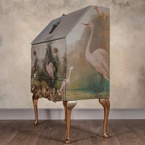 Incredibly eye catching vintage bureau with elegant Heron decoupage and gold leafing. Upcycled with fantastic landscape wrapping around the entire piece featuring white herons. A large scrolled carving has been added to the bottom drawer and highlighted with gold leaf. The legs and inside of the desk part of the bureau have been treated with gold leaf and sealed with gloss finish varnish.Approx Dimensions73 cm wide40 cm deep (narrowing at the top)100 cm tallPlease note that while we do our absol Posh Chalk, Vintage Decoupage, House Uk, Decoration Shabby, Gold Leafing, Set Of Drawers, Old Cottage, Herons, Dixie Belle Paint