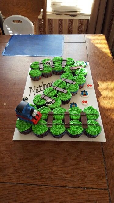 Thomas cupcake #2 cake Thomas The Train Pull Apart Cupcakes, Train Pull Apart Cupcakes, Number 2 Pull Apart Cupcake Cake, Train Cupcakes For Boys, Train Birthday Theme, Train Cupcakes, Thomas Party, Train Theme Birthday Party, Thomas Birthday Parties