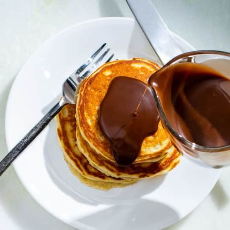 Malted Milk Pancakes with Chocolate-Hazelnut Syrup | Cook's Country Pancake Game, Malted Milk Powder, Milk Pancakes, Flavored Pancakes, Donut Toppings, Caramel Chocolate Bar, Brunch Inspiration, Cookie Toppings, Caramel Tart