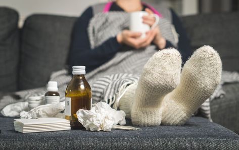 Cold medicine and sick woman drinking hot beverage to get well from flu, fever and virus. Dirty paper towels and tissues on table. Ill person wearing warm woolen stocking socks in winter. Cold Medicine, Overnight Oat, Respiratory Illness, Cold Symptoms, Cold Cough, Stuffy Nose, Common Cold, Cold Remedies, Immune Response