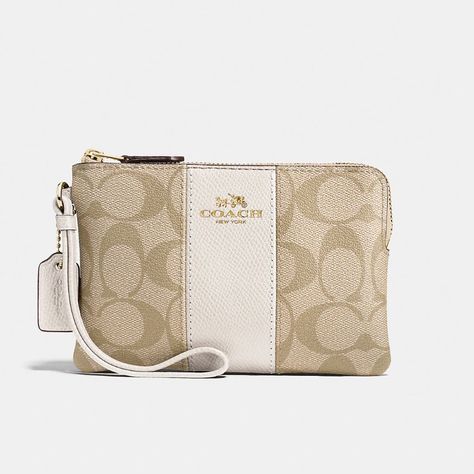 Coach Corner Zip Wristlet In Signature Canvas Color: Gold/Light Khaki Chalk Brand New! In Original Packaging Best Seller Signature Coated Canvas And Crossgrain Leather Two Credit Card Slots Zip-Top Closure, Fabric Lining Wrist Strap Attached 6 1/4" (L) X 4" (H) 1/2" (W) Pretty Tote Bags, Trashy Outfits, School Bag Essentials, Luxury Bags Collection, Handbag Essentials, Cute Wallets, Girly Bags, Fancy Bags, Pretty Bags