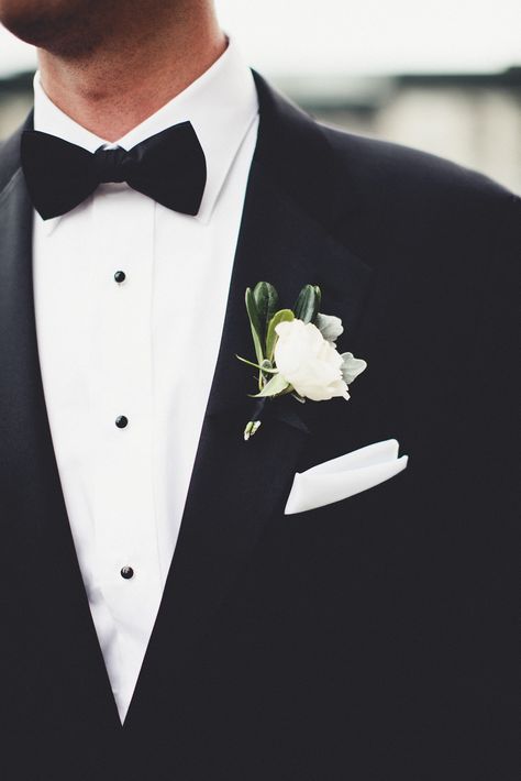 The groom wore a delicate white single flower boutonniere over his white pocket square. Boutineer Wedding, Sparkly Bridesmaids, Sparkly Bridesmaid Dress, Popular Wedding Themes, Orchid Bouquet Wedding, White Pocket Square, White Boutonniere, Flower Boutonniere, Minimalist Wedding Decor