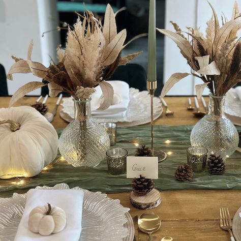 Create an unforgettable dining experience with our Autumn Luxe Tablescape. This elegantly crafted set provides a touch of sophistication with its sage green and white colour combination. Impress your family and friends with this beautiful tablescape; perfect for any autumn-themed occasion. Decor Set x1 Sage Green Cheesecloth Runner x3 Gold Taper Candlesticks x3 Sage Green Taper Candles x2 Cream and Gold Pumpkinsx2 Crystal Cut Glass Ball Vasesx2 Natural Rustic Posiesx5 Gold Mottled T-Lights x1 Se Sage Thanksgiving Decor, Sage Pumpkin Decor, Sage Green And White Fall Decor, Neutral Fall Party Decor, Tablescape For Thanksgiving, Green And Cream Fall Decor, Sage Green Thanksgiving Table, White Pumpkin Tablescape, Green And Gold Thanksgiving Table