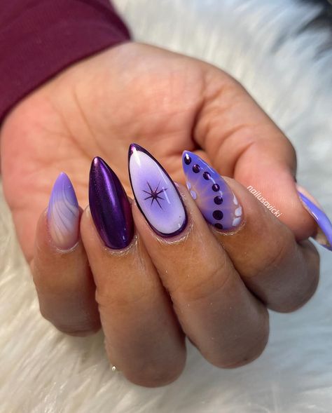 Out with the blue, in with the purple💜 . . . #nails #nailusa #nailart #naildesign #nailsofInstagram #naildesigns #nailsoftheday #naildesignsideas #acrylic #acrylicnails #raleigh #durham #raleighnails #trend #trendynails #winternails Almond Nails Dark Purple, Purple Fall Nails 2024, Purple Abstract Nails, Lilac And Blue Nails, Dark Purple And White Nails, Purple And Teal Nails Designs, Cat Eye Gel Nail Designs, Purple Nails Almond, Lilac Nail Ideas