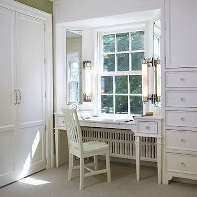 White Bedroom Vanity: idea for radiator in our bedroom? if we used a tiny corner seat it wouldn't cut in to floor space too much.. Vanity In Front Of Window, Closet With Vanity, White Bedroom Vanity, Built In Dressing Table, Bay Window Bedroom, Transitional Closet, Ideas Armario, Mirrored Armoire, Closet Vanity