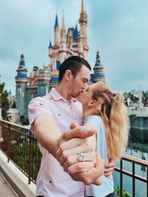 Abby and Dakota share a kiss infront of the Castle at Magic Kingdom in Walt Disney World. They are hugging, and holding hands, outstretching their front arms to show Abby’s new engagement ring. Cinderella Engagement Photos, Disney World Engagement Photos, Disney World Engagement Pictures, Disneyland Engagement Pictures, Disneyland Couples Pictures, Disneyland Photoshoot, Disney Engagement Pictures, Disneyland Engagement Photos, Disney Photoshoot