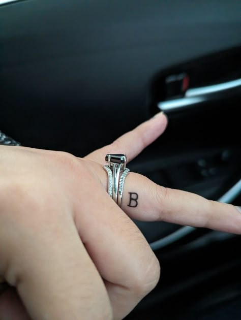 Initial Tattoo On Ring Finger, Husband Name Tattoos For Women, Tattoo On Ring Finger, Finger Letter Tattoos, Name Tattoos For Women, Letter D Tattoo, Husband Name Tattoos, Letter B Tattoo, Side Finger Tattoos