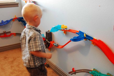 Hot Wheels Wall Tracks Review Hot Wheels Track Organization, Hot Wheel Race Track Storage, How To Store Hot Wheels Tracks, Hot Wheels Track Storage, Hot Wheels Track Diy, Monster Truck Themed Bedroom, Matchbox Storage, Hot Wheels Bedroom, Monster Truck Bedroom