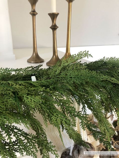 How to attach garland to a fireplace mantel (Sunny Side Up) Cypress Garland Mantle, Greenery On Mantle, Garland Fireplace Mantle, Mantle Greenery, Garland On Mantle, How To Hang Garland On Mantel, Christmas Sheets, Mantle Garland, Hanging Christmas Lights