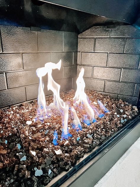 Gas log fireplace converted with fire glass DIY Gas Fireplace Replacement Logs, Gas Fireplace Glass Rocks, Fireplace With Glass Rocks, Gas Fireplace Rocks Inside, Paint Melamine Cabinets, Old Fireplace Ideas, Water Fireplace, Fireplace Filler, Gas Fire Logs