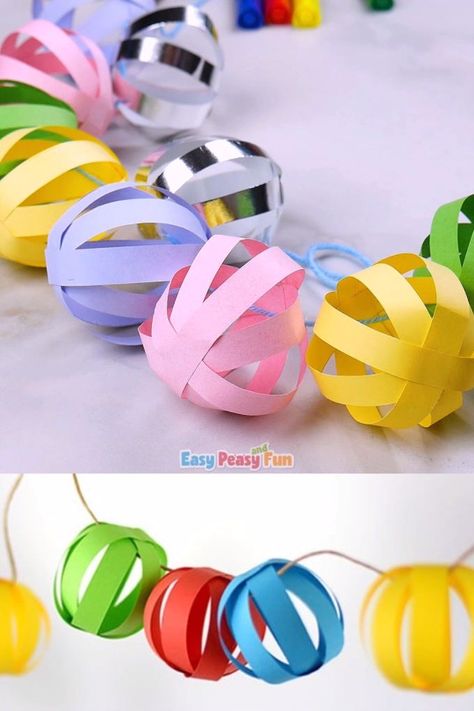 This paper ball garland craft is perfect as a Christmas decoration and it will also look absolutely adorable at any birthday party (any time of the year). Garland Craft, Paper Ball, Paper Balls, Christmas Decorations For Kids, Ball Garland, Christmas Paper Crafts, Kraf Diy, Crafts Paper, Easy Christmas Crafts