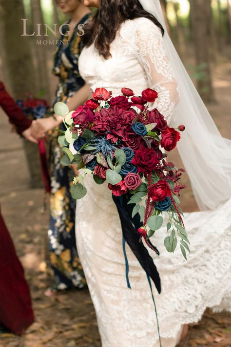 Luxury jewel tone color palette - burgundy, dark red, and navy. This deluxe bridal bouquet will accentuate the romance and sanctity of your wedding! Perfect for a vintage wedding ceremony, bridal shower, dinner as a bridal bouquet. #BridalBouquet #Bouquet #WeddingBouquet #WinterWedding #WeddingIdeas #DIYWedding #RusticWedding #Wedding #WeddingDecor #WeddingFlower #Weddingreception #NavyWedding #BurgundyWedding #RedWedding Navy Wedding Decor, Navy Blue Wedding Decorations, Burgundy And Navy Wedding, Natural Bridal Bouquet, Vintage Wedding Ceremony, Blue Wedding Decorations, Cascading Bridal Bouquets, Large Flower Arrangements, Wedding Flower Packages