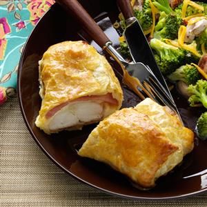 Easy Chicken Cordon Bleu Recipe -"Cordon Bleu" is of French origin meaning "blue ribbon"—given as a prize for culinary excellence. The term also refers to a signature dish of chicken topped with a slice of ham and Swiss cheese, usually breaded and sautéed, or in this case, wrapped in puff pastry for a quick and easy finish. —Sharon Laabs, Hartford, Wisconsin Easy Chicken Cordon Bleu, Puff Pastry Chicken, Cordon Bleu Recipe, Cordon Blue, Chicken Cordon Bleu Recipe, Chicken Ham, Chicken Cordon, Comfort Food Recipes Dinners, Chicken Cordon Bleu