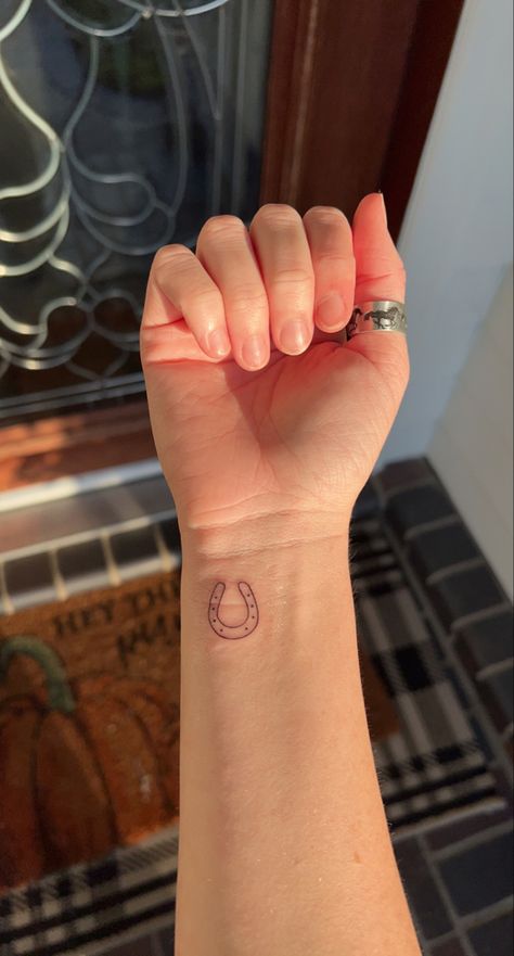 Simplistic Western Tattoos, Horseshoe Ankle Tattoo, Simple Horse Related Tattoos, Horseshoe Wrist Tattoo, Tiny Lucky Tattoo, Minimalist Western Tattoo Ideas, Mini Country Tattoos, Matching Horseshoe Tattoo, Country Simple Tattoos