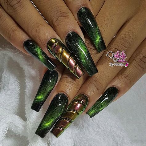 Long coffin nail set with dark green cats eye design, and chrome ring finger with carved horizontal lines. Beautiful nails by Ugly Duckling Exclusive Ambassador and family member @artisticnailsbymarsha Ugly Duckling Nails page is dedicated to promoting quality, inspirational nails created by International Nail Artists #nailartadd Dark Green Nails Long, Green Nails Long Coffin, Green Nail Designs, Eye Nails, Coffin Nails Long, Cat Eye Nails, Nails Long, Cats Eye, Fabulous Nails